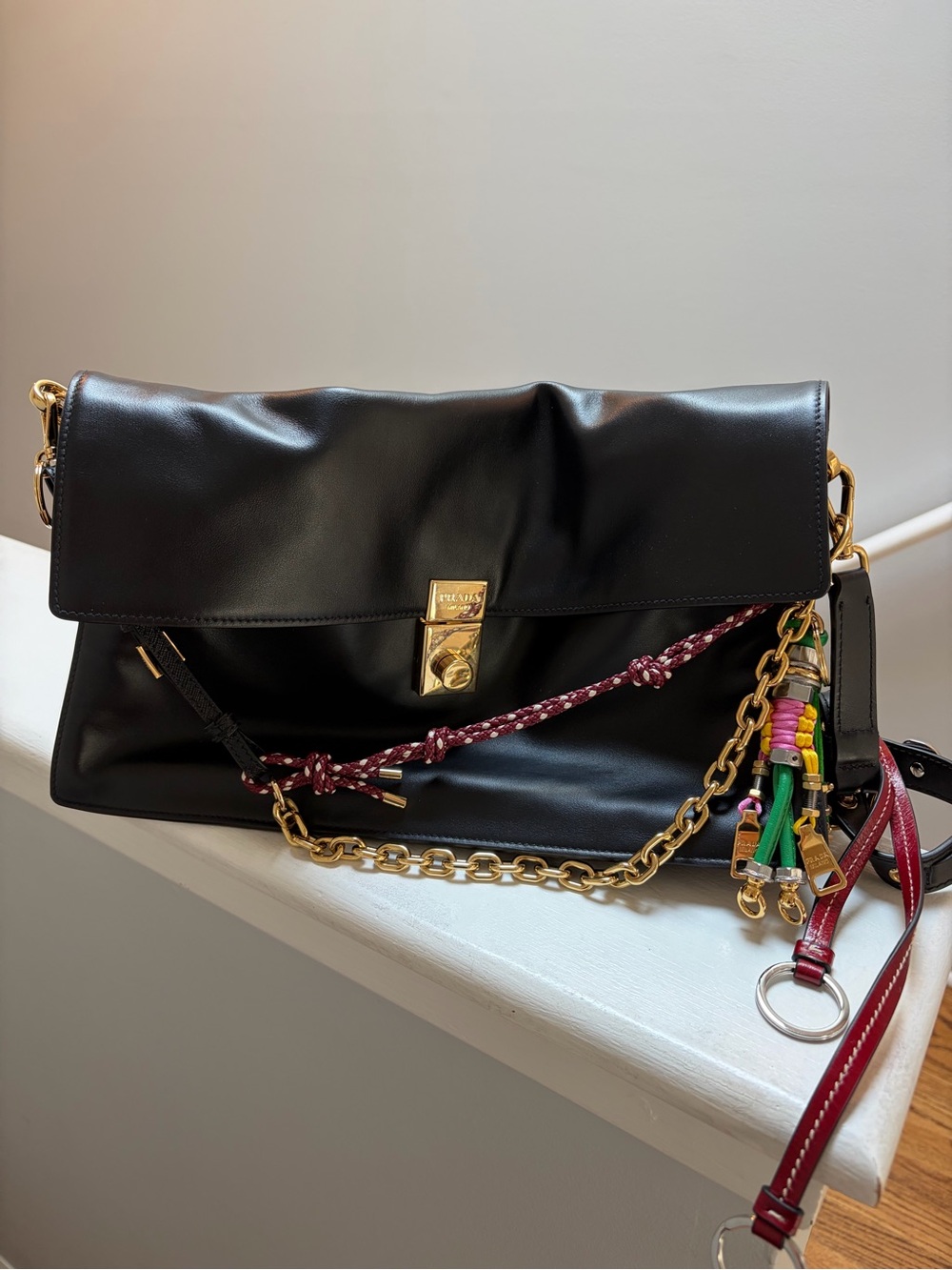 Prada Black Leather Shoulder Bag with Gold Hardware and Multicolor Tassel